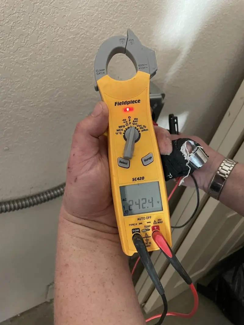 Voltage testing with clamp meter during Electrical Installation Services in Richmond Hill